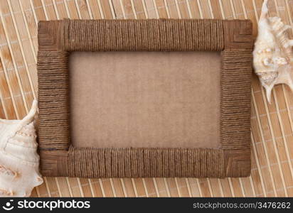 Photo frame of mats and sea shells