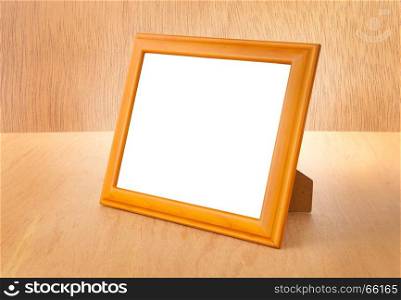 Photo frames on the table and wood background