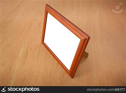 Photo frames on the table wood background