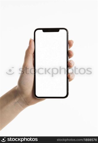 Photo Front view of hand holding smartphone. Resolution and high quality beautiful photo. Photo Front view of hand holding smartphone. High quality beautiful photo concept