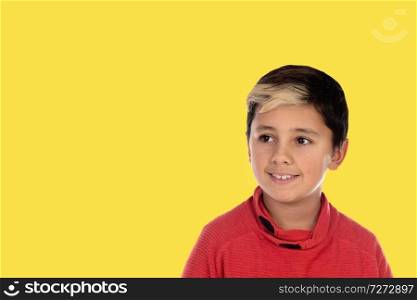 Photo little boy chid with a yellow background. Generation 2018