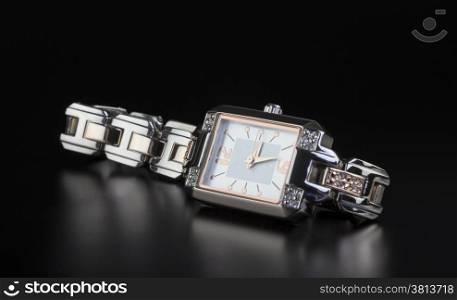 photo luxury woman?s watch on black background