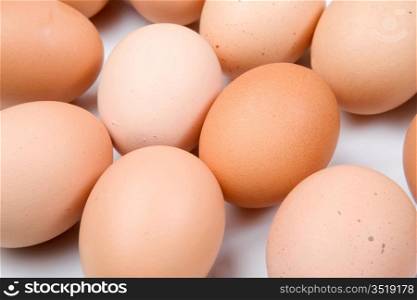 Photo macro of many brown hen eggs