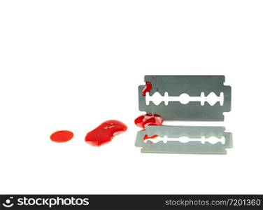 Photo of 2 Razor blade with a drop of blood on white background