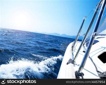 Photo of a 43 foot sailboat in action, speeding at open blue sea, parts of a luxury yacht boat , extreme water sport adventure, freedom and active lifestyle concept