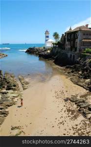 photo of a beach and lighthouse in Cascais, Portugal