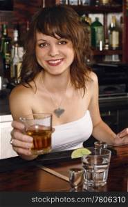 Photo of a beautiful bartender serving you a glass of whisky.