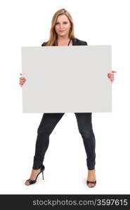 Photo of a beautiful blond female holding a blank sign - ready for your advertisement or message. Clipping path for sign included.