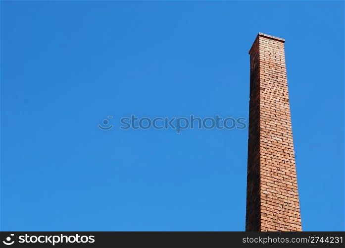 photo of a beautiful brick chimney with sky background