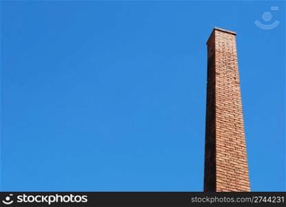 photo of a beautiful brick chimney with sky background