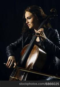 Photo of a beautiful woman playing her old cello.