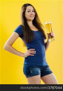 Photo of a beautiful young brunette woman drinking beer from a tall glass.&#xA;