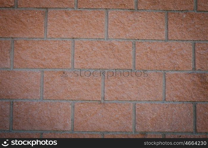 Photo of a building blocks forming a red wall