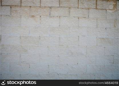 Photo of a building blocks forming a white wall