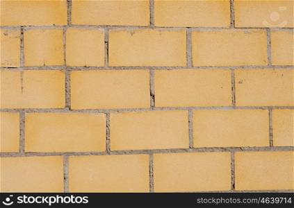 Photo of a building blocks forming a yellow wall