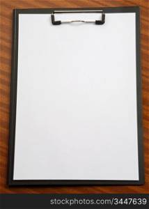photo of a Clipboard a over wood background