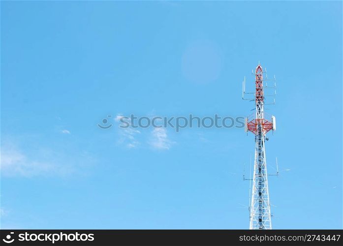 photo of a communication tower against blue sky background