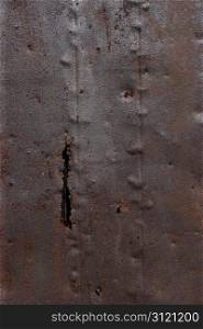Photo of a corroded and rusty metal background.
