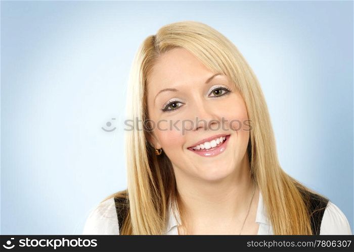 Photo of a cute friendly blonde girl smiling for the camera.