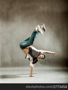 photo of a dancer who is performing extreme break dance movements