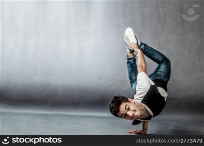 photo of a dancer who is performing extreme break dance movements
