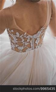 Photo of a free light wedding dress on the bride.. Photo of the wedding dress from the back 2406.
