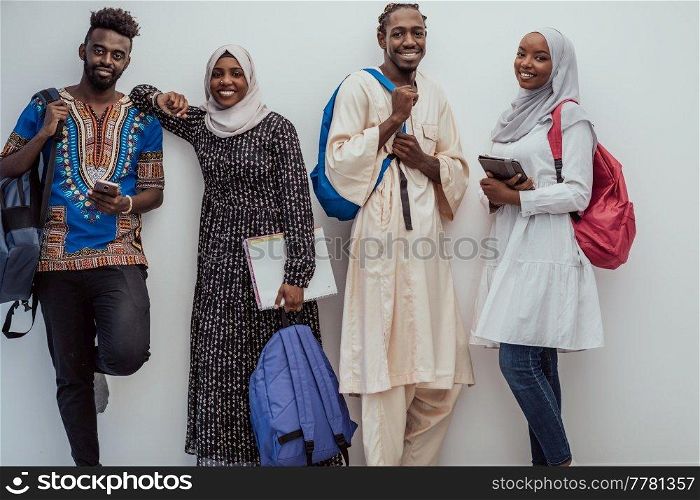 photo of a group of happy African students talking and meeting together working on homework girls wearing traditional Sudanese Muslim hijab. High-quality photo. Photo of a group of happy african students talking and meeting together working on homework girls wearing traditional Sudanese Muslim hijab