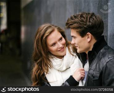 Photo of a happy couple in love outdoors during autumn. Shallow depth of field with focus on the woman. Photo is from the PhotoWalk in Berlin during Microstock Expo.