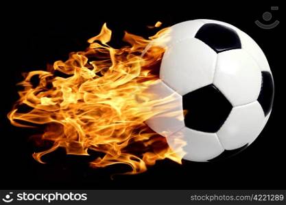 Photo of a leather soccer ball in flames soaring through the air.