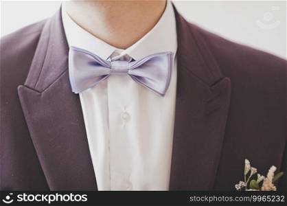 Photo of a man with a close-up of the collar zone.. Close-up photo of a man with a bow tie 2288.