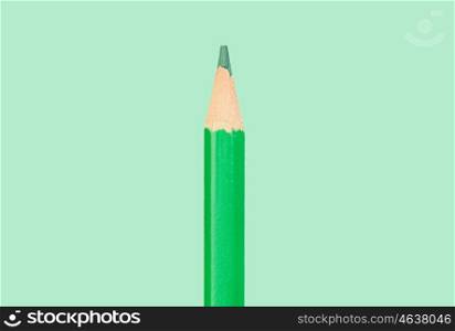 Photo of a pencil on a green background