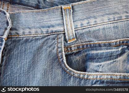 Photo of a pocket jeans with yellow thread