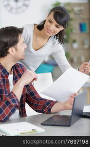 photo of a positive young couple calculating the bills