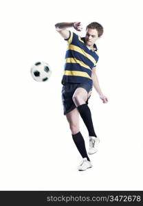 Photo of a strong topless athlete kicking the ball