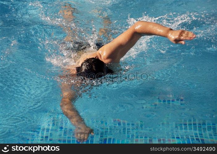 photo of a swimmer doing spring in summer