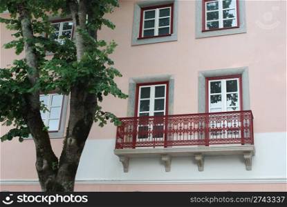 photo of a traditional and mended pink building