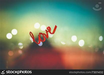 Photo of a word love written on the glass by red lipstick, love message on Valentine&rsquo;s day, love and passion concept