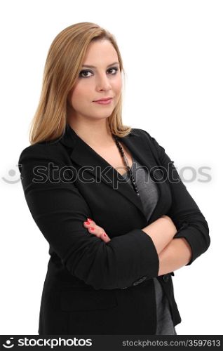 Photo of a young blond business woman standing with her arms crossed.
