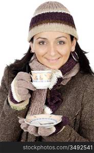 photo of an attractive lady sheltered for the winter drinking a tea cup