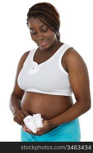 Photo of an attractive pregnant woman a over white background