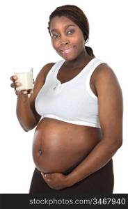 Photo of an attractive pregnant woman drinking milk a over white background