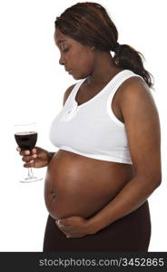Photo of an attractive pregnant woman drinking wine a over white background