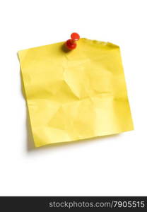Photo of an isolated yellow sticky note pinned to a white background.