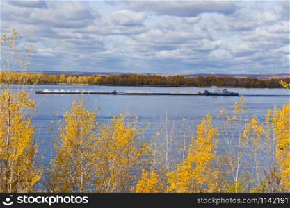 Photo of autumn landscape with barge