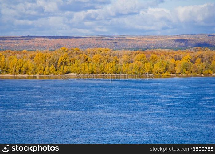 Photo of autumn landscape with forest and river