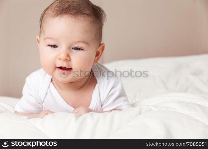 Photo of Baby girl lying on bed
