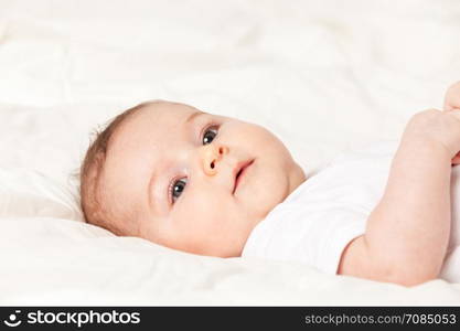 Photo of Baby girl lying on bed