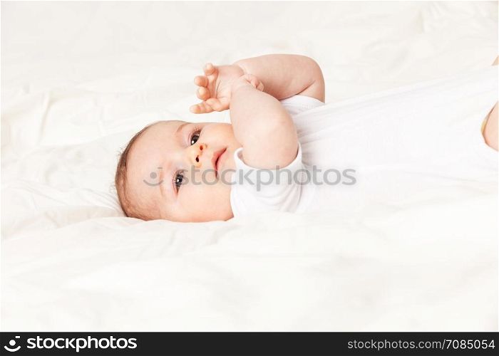Photo of Baby girl lying on bed
