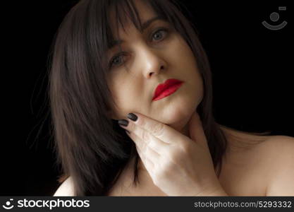 Photo of beautiful brunette with red lips