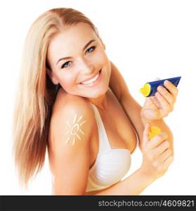 Photo of beautiful happy woman using sunscreen, young pretty lady holding bottle with tanning cream isolated on white background, closeup portrait of cute girl use sunblock, pampering concept&#xA;